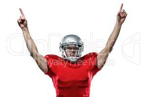 American football player with arms raised standing