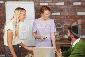 Business colleagues smiling during discussion