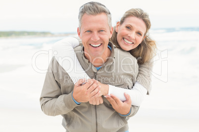 Smiling couple holding one another