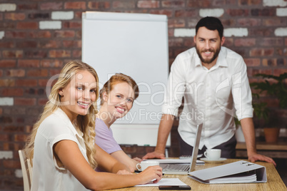 Portrait of happy business people during presentation