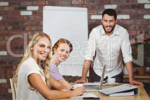 Portrait of happy business people during presentation