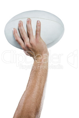 Cropped image of sports player holding ball