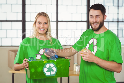 Portrait of happy man holding bottle