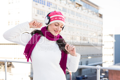 Happy woman listening to headphones