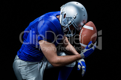 Upset American football player with ball