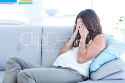 Sick woman relaxing on sofa