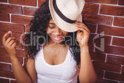 Hipster posing with a hat