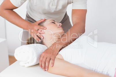 Woman receiving neck massage