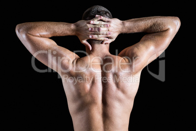 Rear view of shirtless muscular man