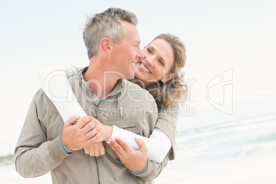 Smiling couple holding one another