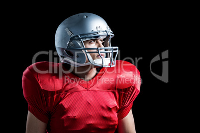 American football player looking away while standing American football player looking away while standing