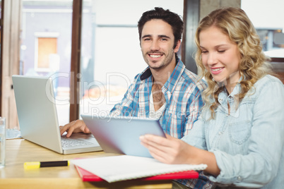 Portrait of man with female colleague