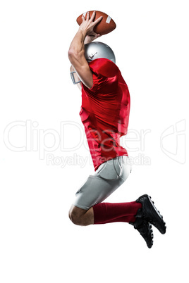 American football player in red jersey jumping