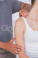 Doctor stretching woman arm