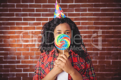 Cute model with hat and lollipop