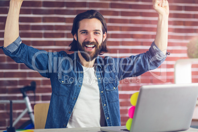 Portrait of cheerful creative businessman in office