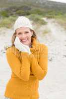 Smiling woman wearing gloves and a hat