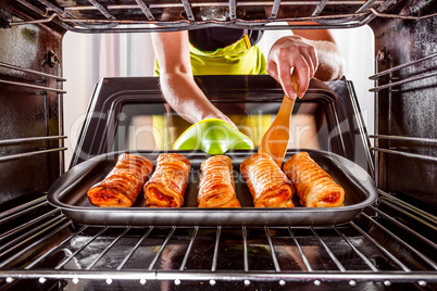 Cooking in the oven at home.