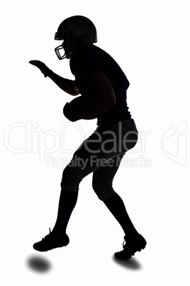 Silhouette sportsman playing American football