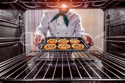 Chef cooking in the oven.