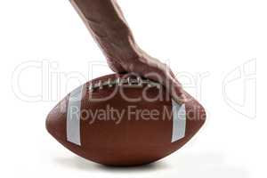 American football player holding ball