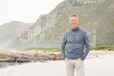 Smiling Man standing at the shore