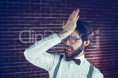 Frustrated hipster with head in hand