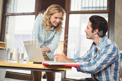 Woman talking to colleague