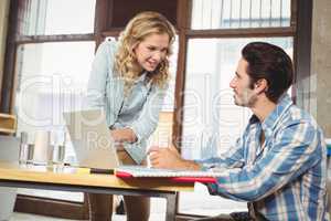 Woman talking to colleague