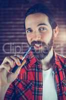 Portrait of handsome man with electronic cigarette