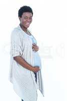 Portrait of happy pregnant woman touching her belly