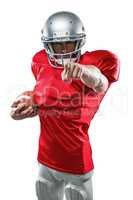 Portrait American football player in red jersey pointing