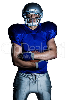 Portrait of confident American football player in uniform