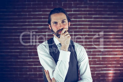 Portrait of serious man with hand on chin