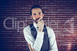 Portrait of serious man with hand on chin