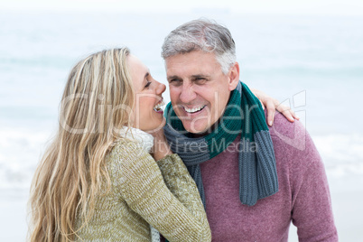 Smiling happy couple hugging each other