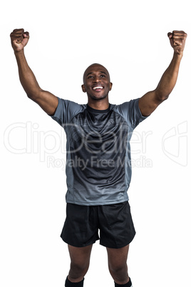 Happy sportsman with clenched fist after victory