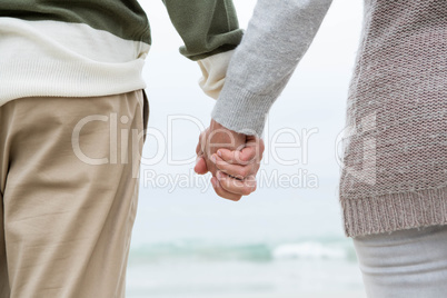 Close up of a couple holdign hands