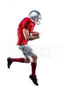 American football player holding ball while running