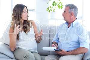 Psychiatrist listning pregenat woman in clinic