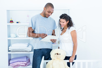 Happy couple looking at document