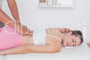 Physiotherapist doing back massage