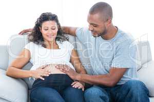 Couple touching belly