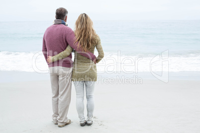 Happy couple standing holding each other