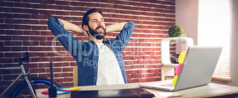 Creative businessman relaxing in office