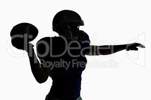 Silhouette American football player throwing ball