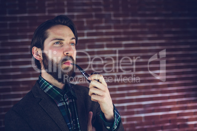 Handsome man smoking pipe