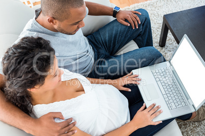 High angle view of couple using laptop
