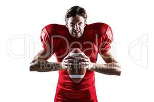 Angry American football player in red jersey holding ball
