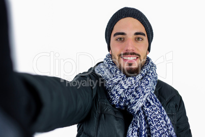 Bearded man using a selfie stick